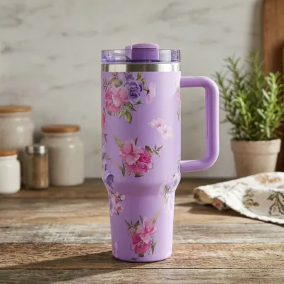 Purple Florence Printed Tumbler 1200ml decorated with colorful floral prints resting on a kitchen table counter