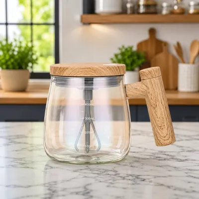 Empty 400ml self stirring glass mug with measurement markings placed on a marble kitchen countertop