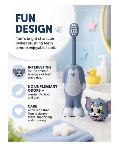 Tom character head removed from the grey Tom and Jerry Kids Toothbrush on a bathroom counter near a yellow duck.
