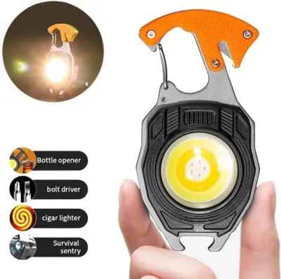 W5147 Keychain Light held in hand showing COB LED light panel with carabiner top and function icons.